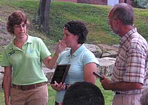 Jan Rybka presents Educator of the Year award to  Kim Swaggard-Svec and James Gazda